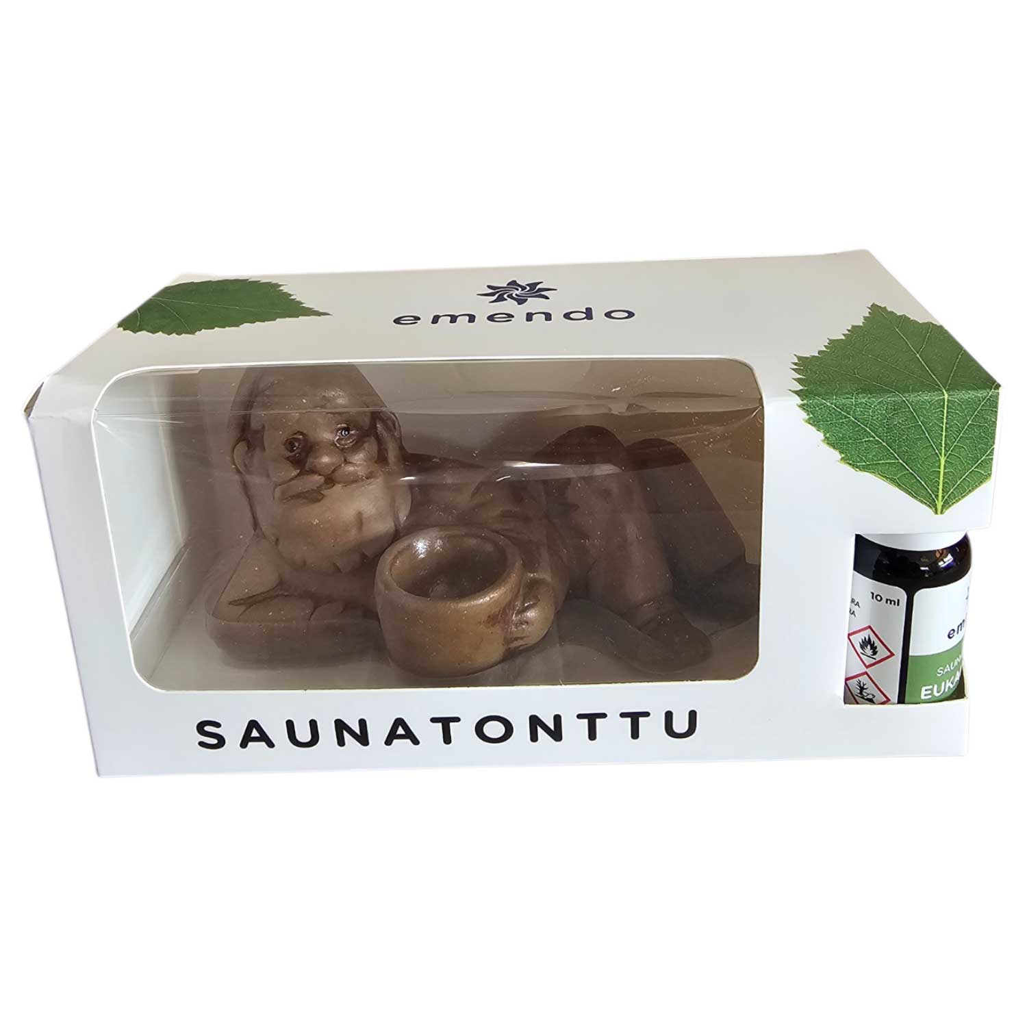 Eine Sauna-Elfenfigur und eine kleine Flasche ätherisches Öl in einer weißen Pappschachtel.