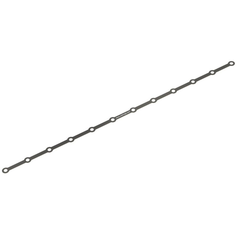 Das Bild zeigt eine lange, schmale Dichtung mit gleichmäßig verteilten kreisförmigen Löchern entlang ihrer Länge.